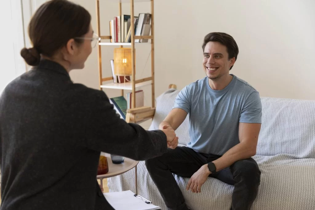 Therapist talking with a patient in an office