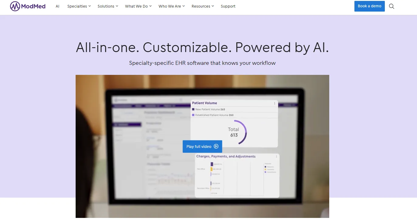 ModMed homepage headline reading all-in-one, customizable, powered by AI, above a laptop showing patient volume and charges dashboards