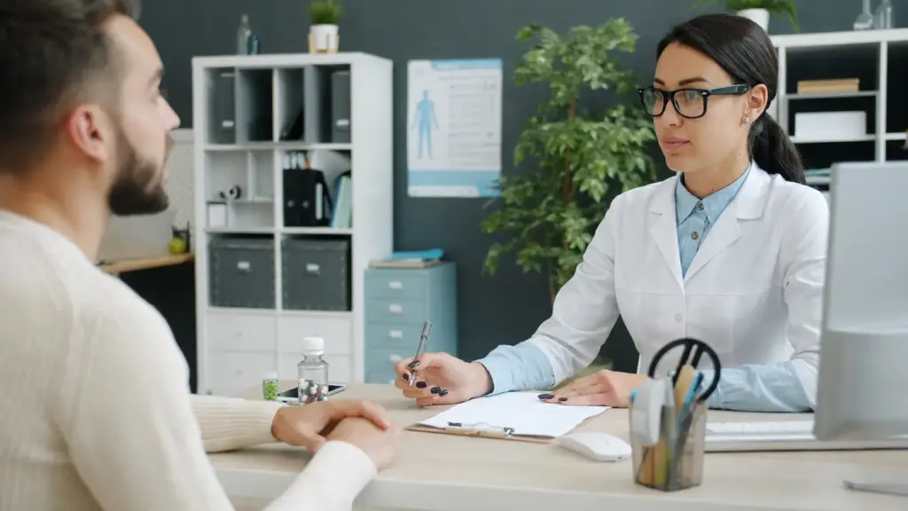 Doctor consulting with a patient in an office.