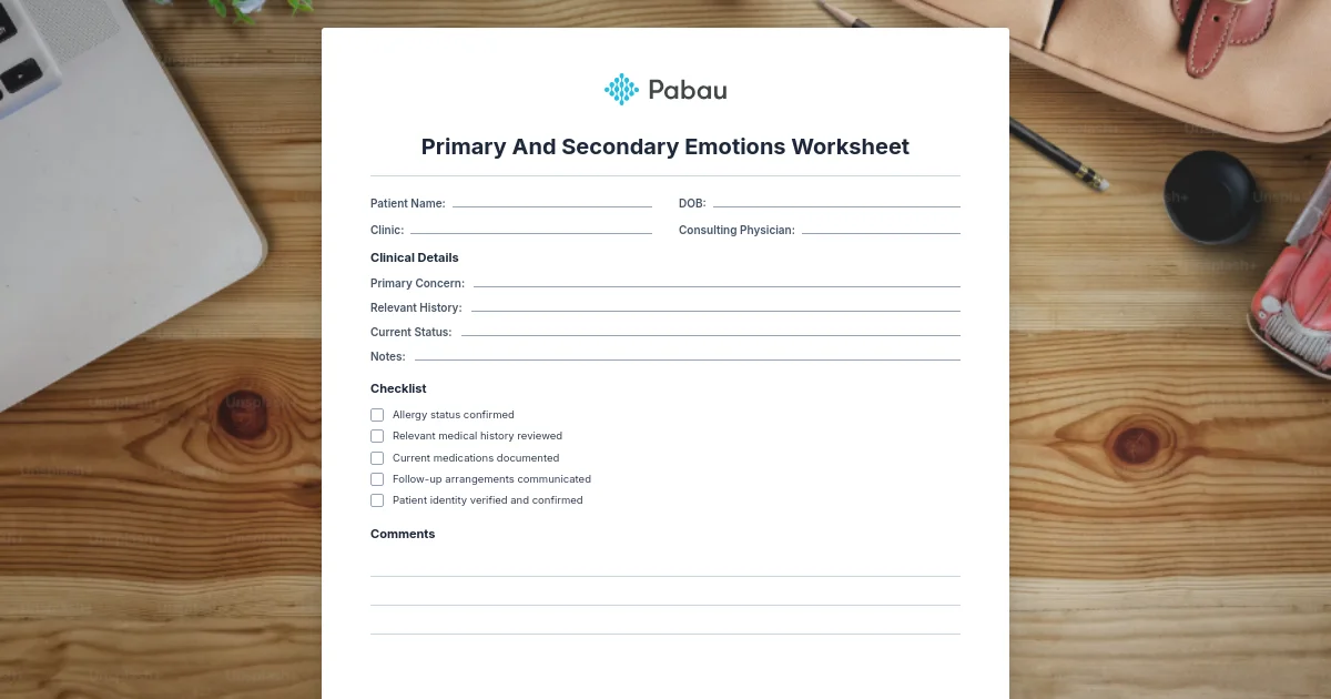 Preview of the Pabau primary and secondary emotions worksheet PDF on a wooden desk